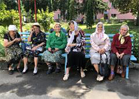 Ukrainian women sitting on a bench