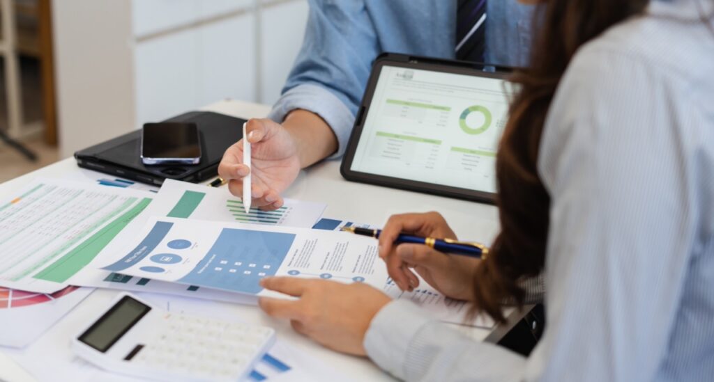 Investment management team reviewing investor data migration checklist during a CRM platform transition to SatuitCRM