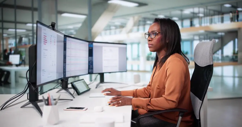 Asset management investor relations team reviewing comprehensive LP relationship record in SatuitCRM showing fund commitment history, compliance documentation, and activity log