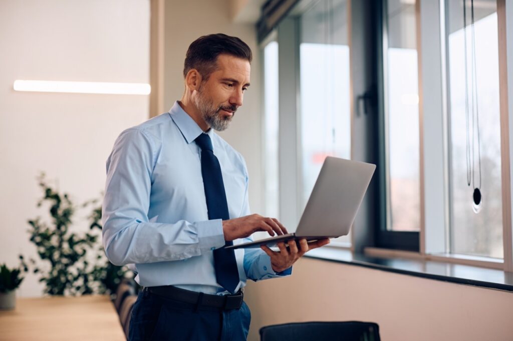 Head of IR reviewing a SatuitCRM custom dashboard with capital raising pipeline data